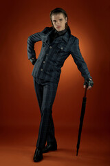 Wearing a black striped jacket, pants, leather shoes, a young businessman. Businessman Walking