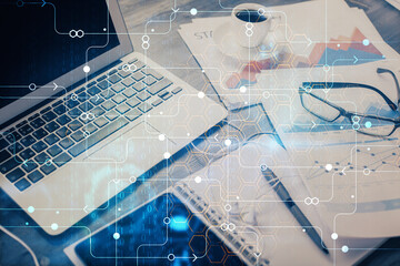 Double exposure of table with computer on background and data theme drawing. Concept of innovation.