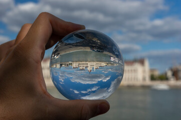 Hungarian Parliament through a crystal ball creating an abstract reflection