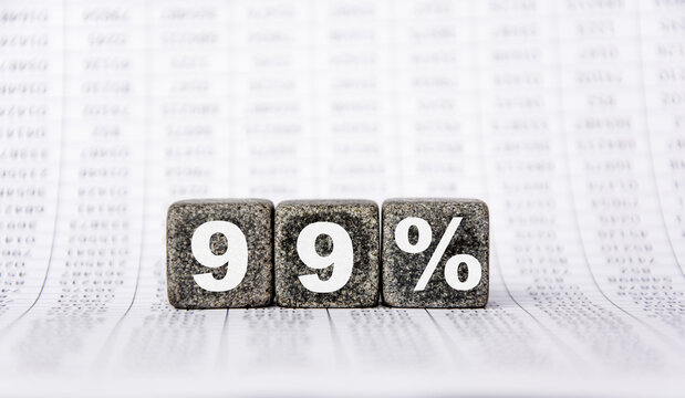 three stone cubes on the background of white financial statements, tables with the word 99 percent. Strong business concept