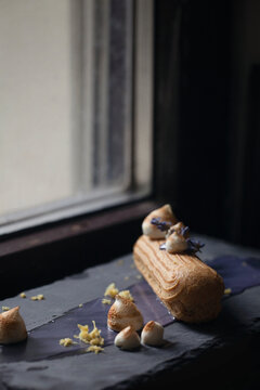 Lavender french eclair next to the window