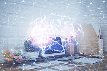 Double exposure of work space with computer and human brain drawing hologram. Brainstorm concept.