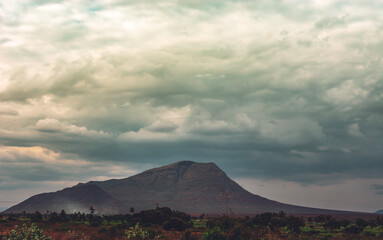 mountain during sunset with dramatic sky