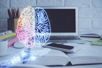 Double exposure of work space with computer and human brain drawing hologram. Brainstorm concept.