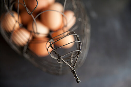 farm fresh brown eggs in vintage hen shaped wire basket