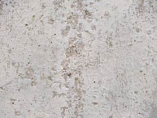 old and white concrete wall with which paint peels off