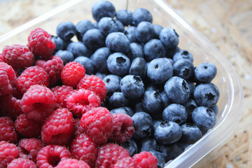 blueberries and raspberries in a bowl