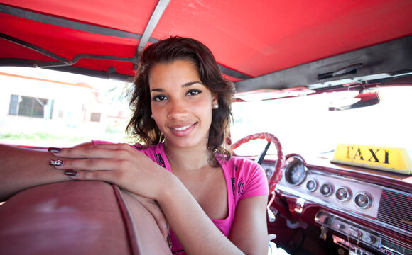 Portrait of Cuban woman in taxi. Havana. Cuba.