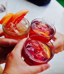 Toasting with negroni cocktails