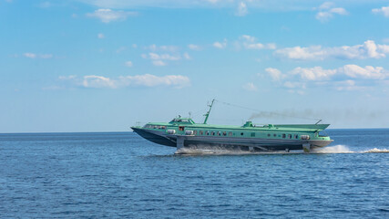 Hydrofoil meteor or comet on Lake Onega. The ship moves on the surface of the lake in a cloud of...