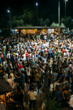 Blurry photo in an outdoors night club in the Summer