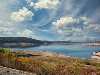 Koprinka Dam, Bulgaria in autumn.
Its water has decreased. You can see its bottom.