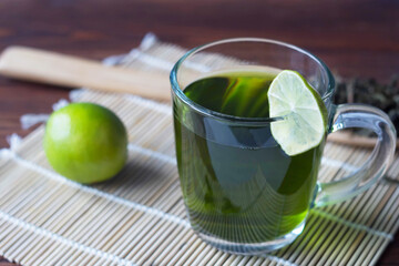 green tea and lime on the table, brew tea