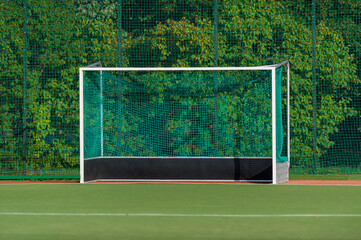 Field hockeyl stadium lifestyle, green grass and hockey gate. Team sport concept