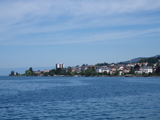 Fototapeta na wymiar Wonderful view of Lake Geneva and european Montreux city in canton Vaud in Switzerland, clear blue sky in 2017 warm sunny summer day on July.