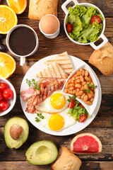 traditional english breakfast with egg, fried bacon, toast