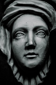 Carved stone face.