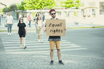 Equall rights. Dude with sign - man stands protesting things that annoy him. Solo demonstration his...
