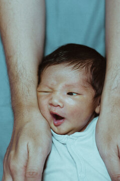 Newborn winced at dad's hairy hands