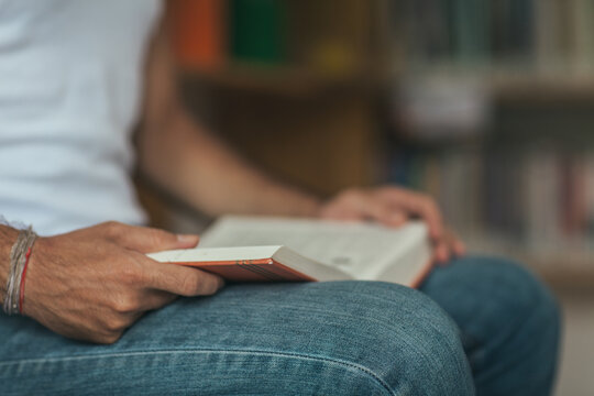 Close Up of a Man Reading a Book in the Library