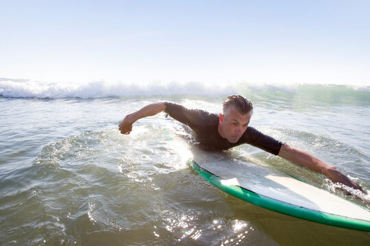 Surf couple at beach.
