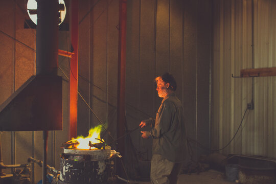 craftsman preheating bronze ingots