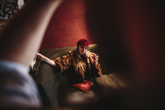 Beautiful Woman drinking alone in a beatnik lounge in San Francisco