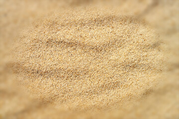 Fototapeta na wymiar A close up of beach sand with blurred frame