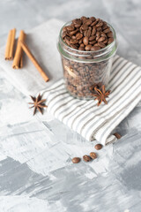 coffee beans in glass jar on white background, no people