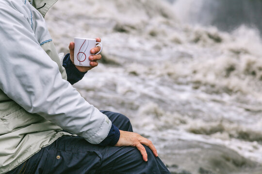 Man Having a Coffe Besides Detifoss Waterfall, Iceland