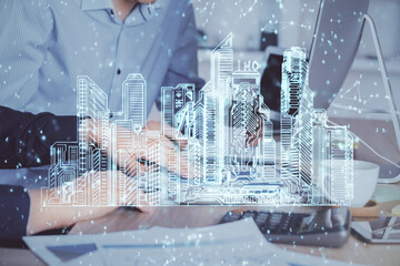 High tech city drawing with businessman working on computer on background. Smartcity concept. Double exposure.