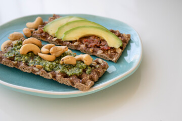 two crackers with pesto on breakfast