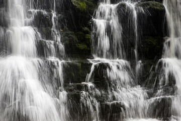 Close up of a large waterfall with trickling white water. Forest of Bowland, Ribble Valley,...