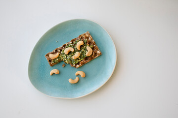 two crackers with pesto on breakfast