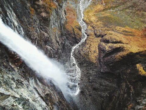 The dramatic waterfall Vettisfossen in Norway from above during the autumn