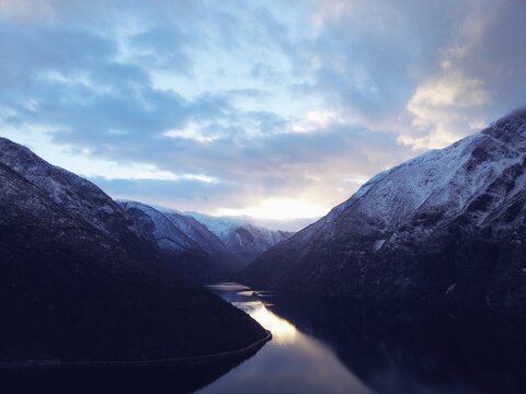 Sunset at a Norwegian fjord trough the mountain landscape