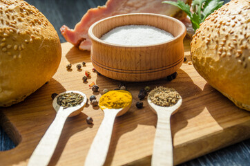 Still life with pieces of bacon on the wooden background