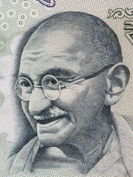 Mahatma Gandhi portrait on indian 100 rupee banknote macro, India money closeup