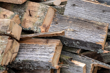A pile of old boards suitable for the furnace, close-up, selective focus.
