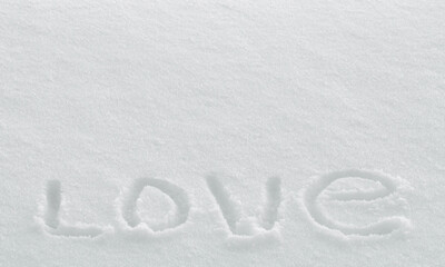 Word love drawing on snow surface, valentine's day greeting card wallpaper