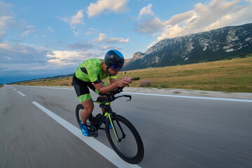 Fototapeta premium triathlon athlete riding bike