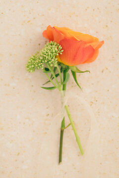 Mini bouquet with an orange rose