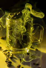 glass filled with coffee bean with smoke 
