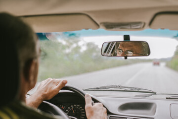 Senior Man Driving Car