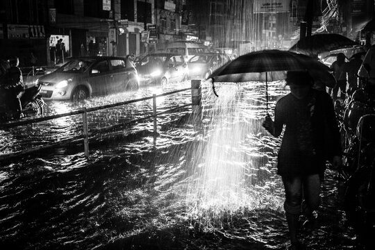 Chaotic monsoon scene of a city street in Asia.