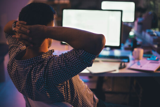 Programmer Working at His Office at Night