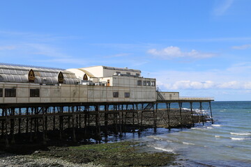 The old jetty, an amusement pier, at Aberystwyth sea front in Ceredigion, Wales, UK