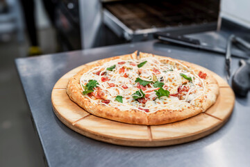 fresh made pizza at the restaurant kitchen desk