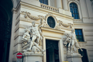 Fototapeta na wymiar Wien, Austria - Statues of Hercules outside the Hofburg Palace in Vienna