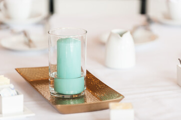 Table Decoration of Candle Inside Clear Glass